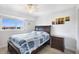 Bedroom with natural light, light wood floors, neutral paint, and ceiling fan at 9461 Harbor Greens Way # 502, Seminole, FL 33776