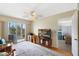 Cozy living room featuring a ceiling fan, balcony access, and a view through the doorway at 9461 Harbor Greens Way # 502, Seminole, FL 33776