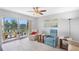 Bright living room featuring neutral furniture, a ceiling fan, and sliding doors to the balcony at 9461 Harbor Greens Way # 502, Seminole, FL 33776