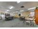 Spacious meeting room featuring tables, chairs, shelving, and a television for community gatherings at 9461 Harbor Greens Way # 502, Seminole, FL 33776