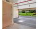 Parking featuring a parking space with a storage locker and green space beyond the open end of the space at 9461 Harbor Greens Way # 502, Seminole, FL 33776