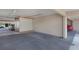Parking featuring a parking space with a storage locker, and other cars parked in the background at 9461 Harbor Greens Way # 502, Seminole, FL 33776