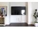 Contemporary wall with mounted TV, decorative accent wall, and modern furnishings enhance the living space at 9481 Highland Oak Dr # 1310, Tampa, FL 33647