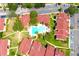 Aerial view of a condominium community and pool with parking and manicured landscaping at 9481 Highland Oak Dr # 1310, Tampa, FL 33647