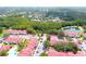 Expansive aerial view showing community townhomes, parking, a pool, and green space at 9481 Highland Oak Dr # 1310, Tampa, FL 33647