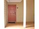 Inviting entrance featuring a covered porch and a solid wood front door with a 'hello' mat at 9481 Highland Oak Dr # 1310, Tampa, FL 33647
