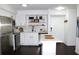 Bright kitchen with island, white cabinets, stainless steel appliances, and natural light at 9481 Highland Oak Dr # 1310, Tampa, FL 33647