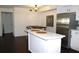 Modern kitchen featuring stainless steel appliances and breakfast bar seating in an open layout at 9481 Highland Oak Dr # 1310, Tampa, FL 33647