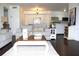 Inviting living area with open layout, connecting the living space with the kitchen and dining area at 9481 Highland Oak Dr # 1310, Tampa, FL 33647