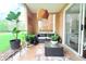 Cozy patio with wicker furniture, plants, and a view of the outdoor greenery at 9481 Highland Oak Dr # 1310, Tampa, FL 33647