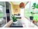 Cozy patio with wicker furniture, plants, and a view of the outdoor greenery at 9481 Highland Oak Dr # 1310, Tampa, FL 33647