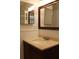 A clean bathroom featuring a single sink vanity with a dark wood cabinet, and wainscotting on the walls at 9705 45Th N Way, Pinellas Park, FL 33782