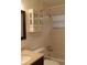 This bright bathroom features a shower, toilet, and sink with plenty of cabinet space at 9705 45Th N Way, Pinellas Park, FL 33782