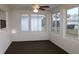 Enclosed Florida room with windows and ceiling fan at 9705 45Th N Way, Pinellas Park, FL 33782