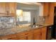Well-appointed kitchen with granite countertops, stainless steel dishwasher, and accent lighting at 9705 45Th N Way, Pinellas Park, FL 33782