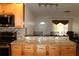 Kitchen with stainless steel appliances and granite countertops, overlooking adjacent room at 9705 45Th N Way, Pinellas Park, FL 33782