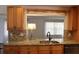 Kitchen with granite countertops, stainless steel dishwasher, and pendant lighting at 9705 45Th N Way, Pinellas Park, FL 33782