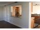 View of the kitchen from the living room, featuring stone countertops at 9705 45Th N Way, Pinellas Park, FL 33782
