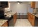 Open kitchen design with granite countertops, stainless steel appliances, and tile flooring at 9705 45Th N Way, Pinellas Park, FL 33782