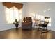 Comfortable living room featuring a recliner, rocking chair, and natural light at 9705 45Th N Way, Pinellas Park, FL 33782