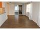 Open living room with wood floors leading to the kitchen and Florida room at 9705 45Th N Way, Pinellas Park, FL 33782