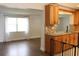 Bright living room with hardwood floors and a view of the kitchen at 9705 45Th N Way, Pinellas Park, FL 33782