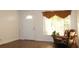 Cozy living room with a rocking chair, a recliner chair, and natural light at 9705 45Th N Way, Pinellas Park, FL 33782