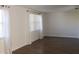 Living room with wood floors, white walls, and large windows at 9705 45Th N Way, Pinellas Park, FL 33782