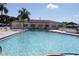 Community pool with ample space to relax under the sun at 9705 45Th N Way, Pinellas Park, FL 33782