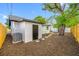 An outside shot of the backyard, showing a shed, fence, and new landscaping at 4626 8Th S Ave, St Petersburg, FL 33711