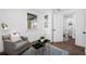 Bright room with modern white trim, gray walls, a gray chair and a blue rug at 4626 8Th S Ave, St Petersburg, FL 33711