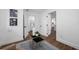 Bright room with modern white trim, gray walls, a gray chair and a blue rug at 4626 8Th S Ave, St Petersburg, FL 33711