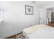 Bright bedroom featuring a soft throw, white linen and view of dining area at 4626 8Th S Ave, St Petersburg, FL 33711