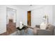 Bright room with modern white trim, gray walls, a gray chair and a blue rug at 4626 8Th S Ave, St Petersburg, FL 33711