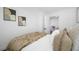 Comfortable bedroom with view of a dining area, soft bedding, and tasteful accents at 4626 8Th S Ave, St Petersburg, FL 33711