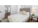 Clean bedroom boasts a neutral color scheme and views into the dining area at 4626 8Th S Ave, St Petersburg, FL 33711