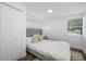Bright bedroom featuring hardwood floors, neutral decor, and a large window at 4626 8Th S Ave, St Petersburg, FL 33711