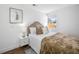 Cozy bedroom with a comfortable bed, stylish nightstand, and soothing natural light at 4626 8Th S Ave, St Petersburg, FL 33711