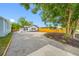 Expansive driveway leading to a beautifully landscaped home at 4626 8Th S Ave, St Petersburg, FL 33711