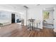 Open-concept living room with modern barstools and plenty of natural light at 4626 8Th S Ave, St Petersburg, FL 33711