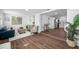 Bright living room with modern furnishings and an open floor plan to kitchen at 4626 8Th S Ave, St Petersburg, FL 33711
