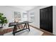Bright office space with a modern desk, stylish decor, and wood grain floors at 4626 8Th S Ave, St Petersburg, FL 33711