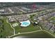 Community aerial view showcasing a pool, tennis courts, playground and homes at 10308 Malvasia Ave, Riverview, FL 33578