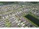 An aerial view of a community with lush landscaping and multiple ponds at 10308 Malvasia Ave, Riverview, FL 33578