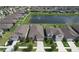 From above, enjoy a neighborhood with a beautiful lake and mature trees at 10308 Malvasia Ave, Riverview, FL 33578