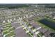 An aerial view of a community featuring lush landscaping and neighborhood ponds at 10308 Malvasia Ave, Riverview, FL 33578