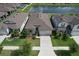 An aerial shot of a well-maintained home, showcasing its proximity to a serene pond and neighborhood at 10308 Malvasia Ave, Riverview, FL 33578