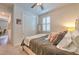 Neutral-toned bedroom with carpet, featuring a window with shutters and closet at 10308 Malvasia Ave, Riverview, FL 33578