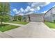 Well-manicured front lawn complements this charming single-Gathering home with an attached two car garage at 10308 Malvasia Ave, Riverview, FL 33578