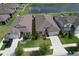 An aerial shot of home exteriors with manicured lawns and decorative landscaping at 10308 Malvasia Ave, Riverview, FL 33578